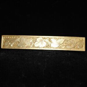 Antique Engraved Golden Bar Brooch Featuring Leaves and a Flower